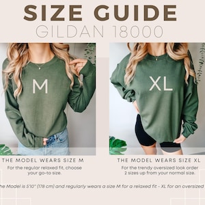 May include: Size guide for Gildan 18000 sweatshirts. The image shows two models wearing olive green sweatshirts, one in size M and the other in size XL. Text explains sizing for a relaxed or oversized fit. The model is 5'10" (178 cm) and wears M for relaxed fit.