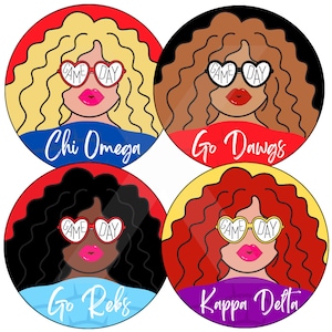 May include: Four round stickers with images of women with curly hair wearing heart-shaped sunglasses that say "Game Day". Each sticker has a different sorority name and a different color scheme. The stickers are: Chi Omega (red, white, and blue), Go Dawgs (red, white, and black), Go Rebs (red, white, and blue), and Kappa Delta (yellow, purple, and white).