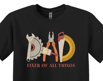 May include: Black t-shirt with a graphic of tools spelling out "DAD" and the text "Fixer of all things".