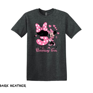 May include: Dark heather grey t-shirt with a pink number three and a pink Minnie Mouse graphic. The text "Birthday Girl" is printed below the graphic.