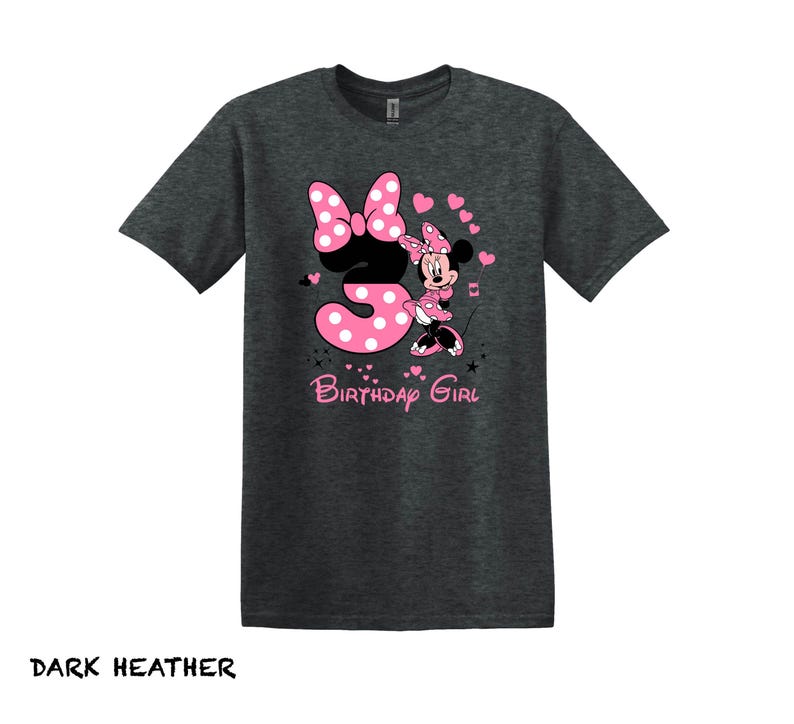 May include: Dark heather grey t-shirt with a pink number three and a pink Minnie Mouse graphic. The text "Birthday Girl" is printed below the graphic.