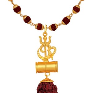 May include: A gold necklace with a pendant featuring the Om symbol, a trident, and a rudraksha bead. The necklace is made of red beads and a gold chain.