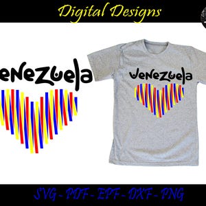 K&ouml;nnte beinhalten: Ein graues T-Shirt mit dem Wort "Venezuela" in schwarzer Schrift und einem herzf&ouml;rmigen Design aus gelben, blauen und roten Streifen. Das Design ist auch als separates Grafik verf&uuml;gbar.