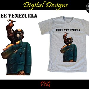 K&ouml;nnte beinhalten: Ein graues T-Shirt mit dem Text "FREE VENEZUELA" auf der Vorderseite. Das Design zeigt einen Mann in gr&uuml;ner Uniform, der einen Hammer h&auml;lt, w&auml;hrend ein anderer Mann in brauner Uniform auf seinen Schultern steht.