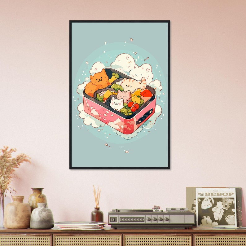 May include: A pink and white bento box with a cloud-like design, filled with colorful vegetables and four cartoon cats. The box is surrounded by a light blue background with white dots.