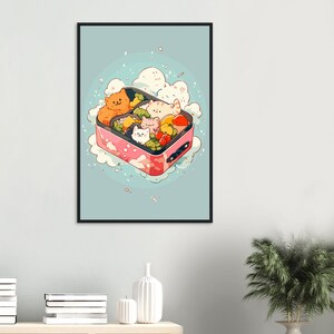 May include: A pink and white bento box with a cartoon illustration of cats and vegetables. The box is surrounded by white clouds and a light blue background.