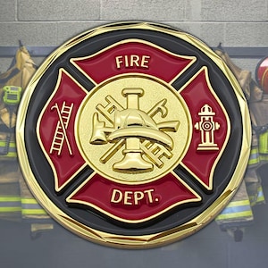 May include: A gold-coloured firefighter coin with a red and black Maltese cross design. The centre features a gold helmet, axes, and other tools. The words "FIRE DEPT." are displayed.