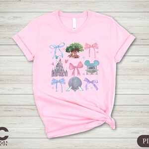a pink tshirt with a picture of minnie mouse and other items