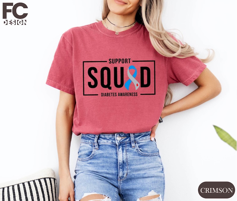 a woman wearing a t - shirt that says support squid