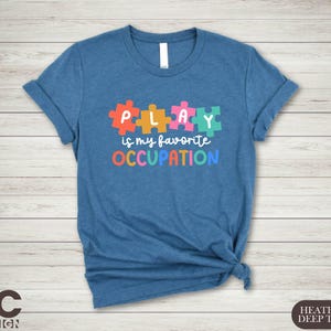 a t - shirt that says play is my favorite occupation