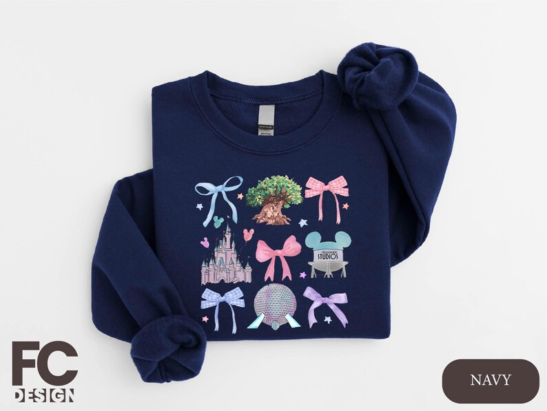 a blue shirt with a picture of a castle on it