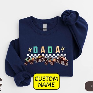 a blue shirt with a picture of a racing car on it