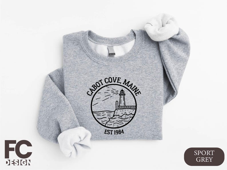 a gray sweatshirt with a lighthouse on it