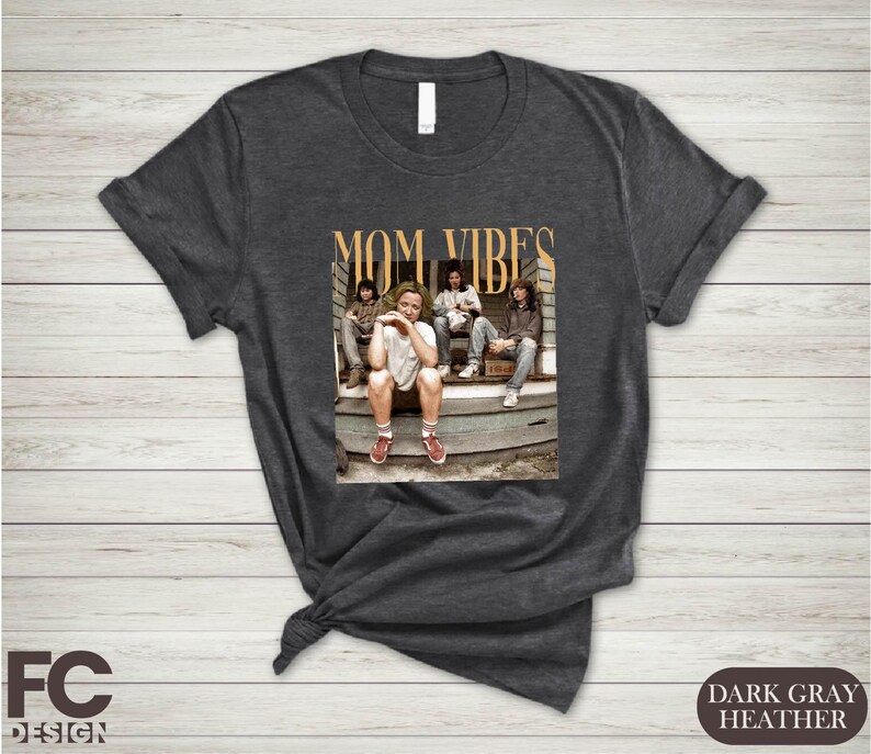 a t - shirt with a picture of a group of people sitting on the steps