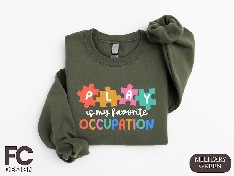 a green sweatshirt with puzzle pieces on it
