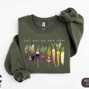 a green shirt with a bunch of vegetables on it