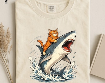 Cat Riding Shark Shirt, Funny Comfort Colors Tee, Orange Tabby Cat Graphic T-Shirt, Ocean Animal Lover Sweater, Weird Meme Aesthetic Top
