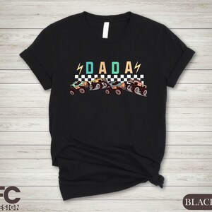 a black shirt with the word dad on it