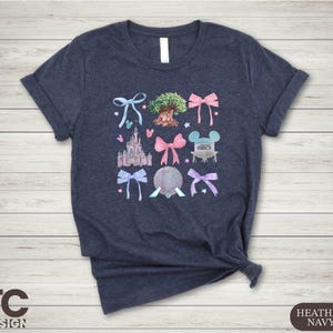 a t - shirt with a picture of a castle and other things on it