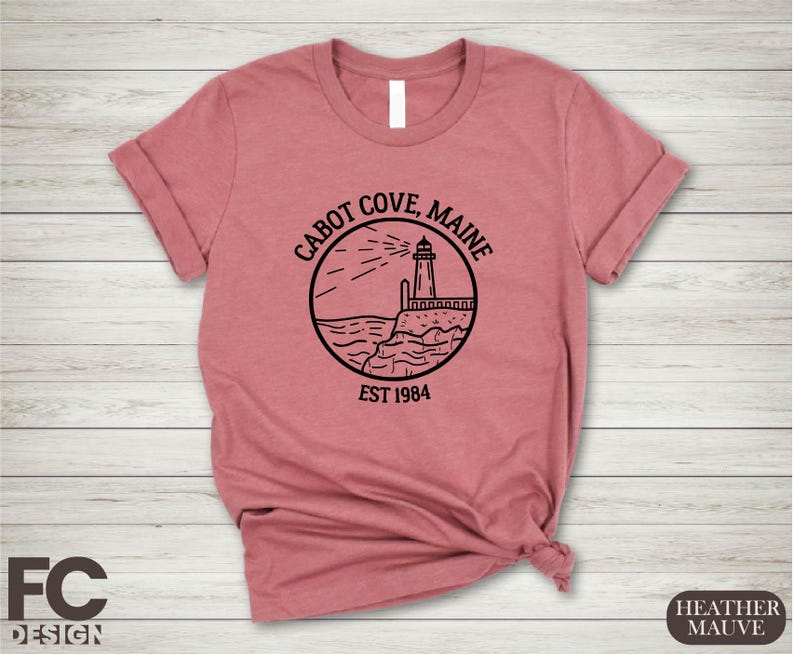 a pink shirt with a lighthouse on it