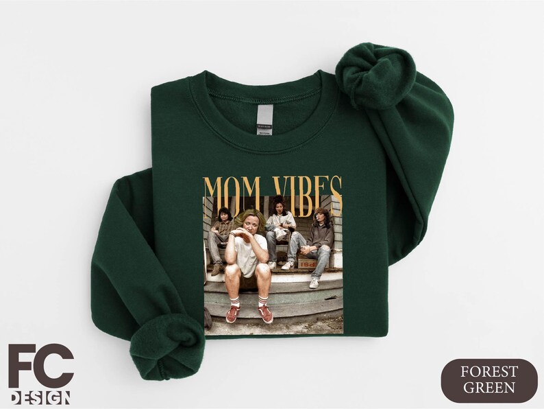 a green shirt with a picture of a group of people on it