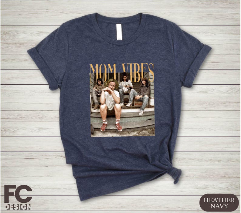 a women's t - shirt with a picture of a group of people sitting