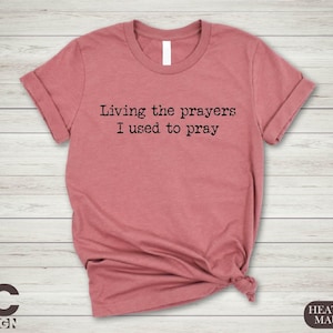a t - shirt that says living the prayer i used to pray