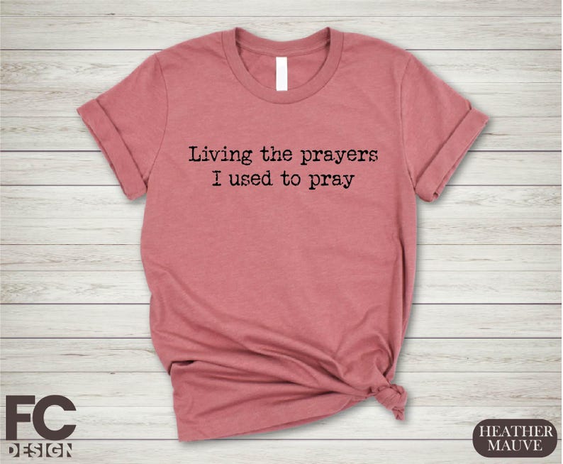 a t - shirt that says living the prayer i used to pray