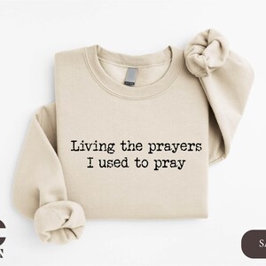 a t - shirt that says living the prayer i used to pray