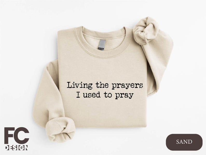 a t - shirt that says living the prayer i used to pray