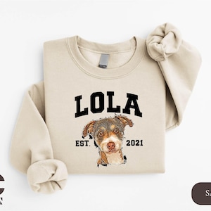 a sweater with a dog's face on it