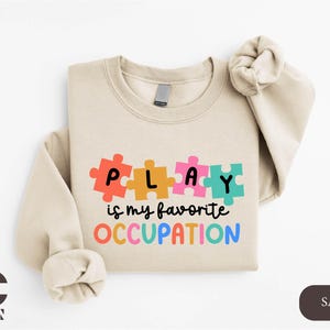 a sweater with a puzzle piece on it