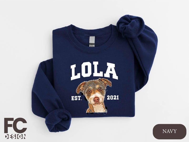 a blue sweatshirt with a picture of a dog on it