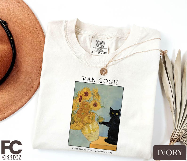 a t - shirt with a picture of a vase of sunflowers and a