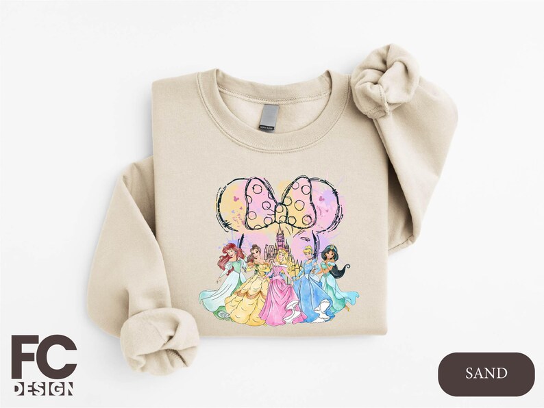 a sweatshirt with a picture of a group of princesses on it