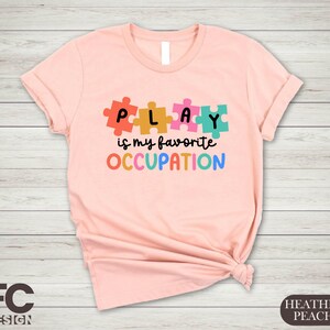 a t - shirt that says play is my favorite occasion
