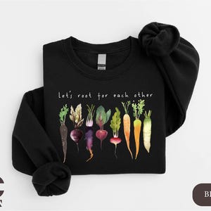 a black shirt with a bunch of vegetables on it