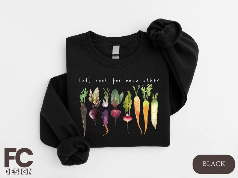a black shirt with a bunch of vegetables on it