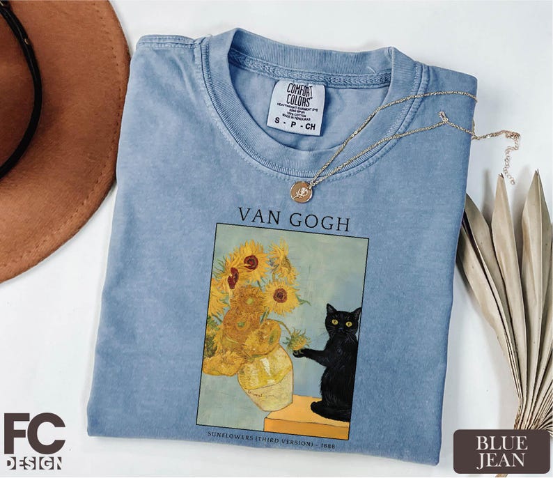 a t - shirt with a picture of a vase of sunflowers and a