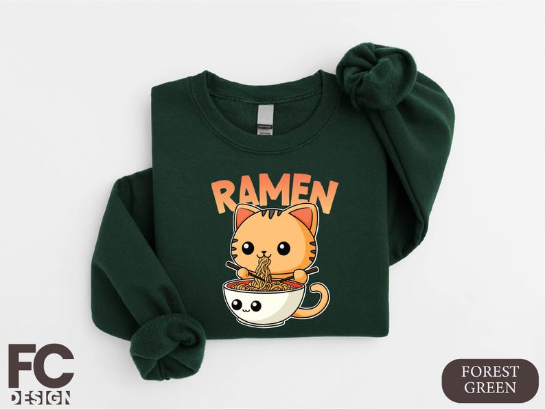 a green shirt with a cat in a cup of ramen