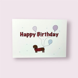 Geburtstagskarte Dackel – Happy Birthday | Lustige Grußkarte mit Hund und Ballons | Postkarte handgezeichnet | Kraftpapier & matt