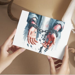 May include: A watercolor painting of a person's hands bound by a chain that is breaking apart. The hands are shown with detail and the chain is painted in a realistic style.