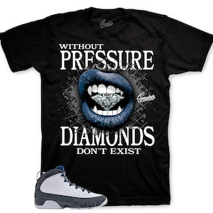 May include: Black t-shirt with the text "WITHOUT PRESSURE DIAMONDS DON'T EXIST" and a graphic of blue lips holding a diamond. A pair of white and gray sneakers with blue accents are at the bottom.