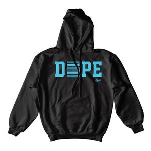 May include: Black hooded sweatshirt with the word "DOPE" in light blue block letters across the chest. The letter "O" is designed with horizontal lines. A small "Sneakers" logo is below the word.