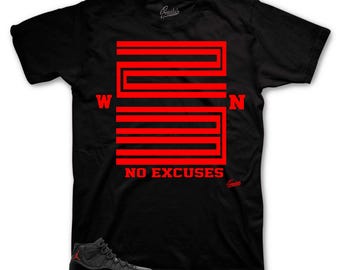 May include: Black t-shirt with a red graphic of the number 23 and the words "NO EXCUSES". A pair of black and red sneakers are in the bottom left corner of the image.