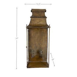 May include: A vintage-style, bronze-colored wall lantern. The lantern is 37 inches tall, 15.5 inches wide, and 10 inches deep. It features a decorative top and two candle holders inside. The metal has a distressed finish.