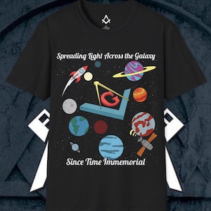 May include: Black t-shirt with a graphic design of a compass and planets with the text "Spreading Light Across the Galaxy" and "Since Time Immemorial".