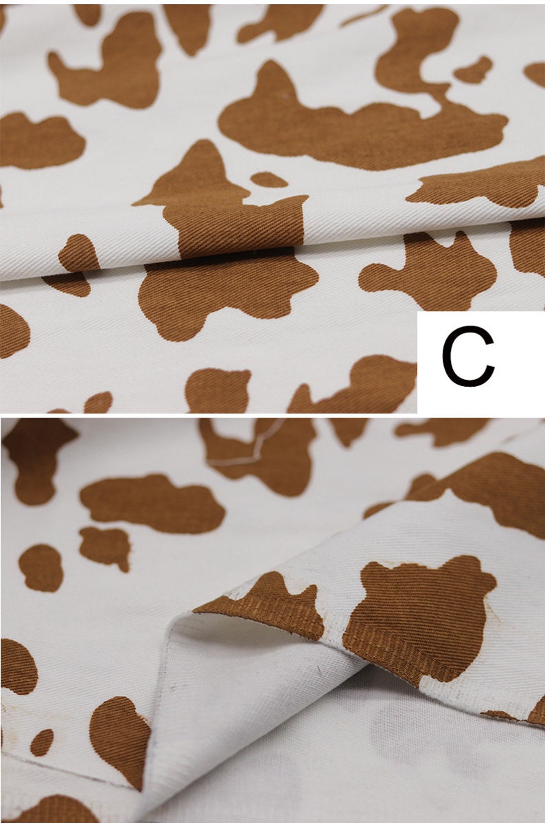 May include: Close-up of white fabric with brown cow print. The fabric has a textured, corduroy-like surface. The letter "C" is visible in the upper right corner of the image.