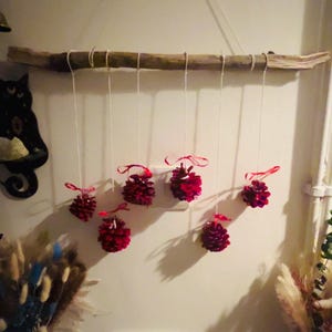 handmade natural wood & pine cones wall hanging pine cone at in red with red ribbon