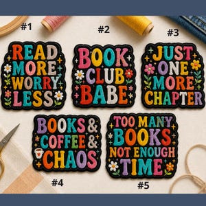 May include: Five colorful embroidered patches with black borders. The patches feature phrases like "Read More Worry Less" and "Book Club Babe" in various fonts and colors, decorated with flowers. The patches are for book lovers.